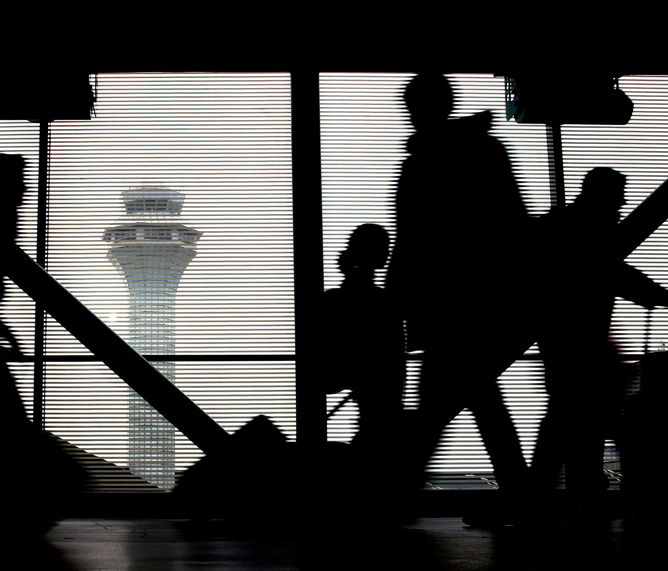 Travelers walk through Terminal 3 at Chicago's O'Hare International Airport on Nov. 23, 2016.