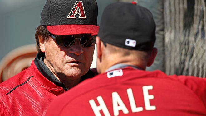 Arizona Diamondbacks Chief Baseball Officer Tony La Russa talks to manager Chip Hale during spring training practice on Wednesday, Feb.25, 2015, near Scottsdale.