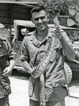 Tyrus Cobb and a cobra - not the helicopter variety - in Vietnam, where he served as an adviser to Vietnamese troops.