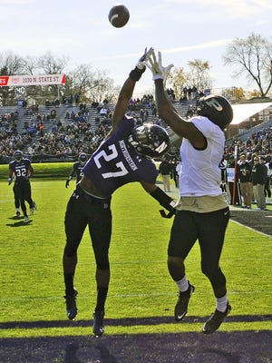 Northwestern Wildcats cornerback Matthew Harris (27) breaks up a pass in the end zone intended for Purdue  wide receiver DeAngelo Yancey (7) during the first half of an NCAA college football game in Evanston, Ill.,  Saturday, Nov. 14, 2015.
