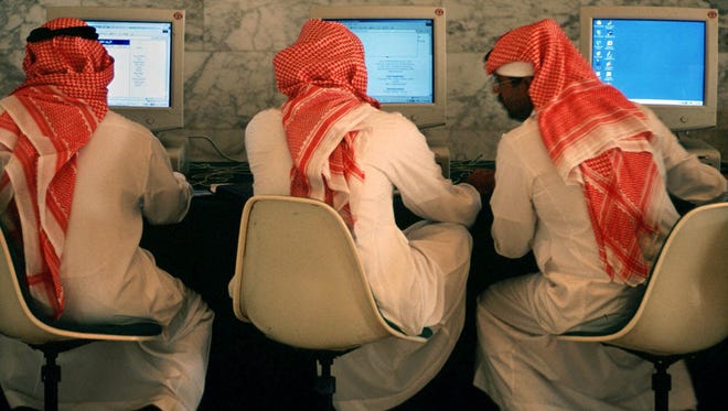 Saudi men talk and browse the Internet at a hotel in Riyadh, the capital of Saudi Arabia.