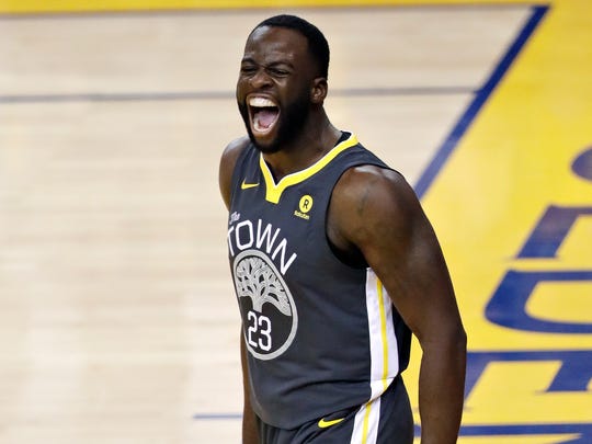 Draymond Green celebrates after scoring against the Cavaliers during Game 2 of the 2018 NBA Finals on June 3.