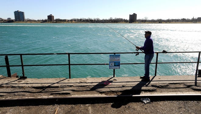 Joe Bates, 58, of Southfield, fishes for Walleye at the end of Rosa Parks Blvd. just south of Jefferson on the west end of West Riverfront Park, Saturday afternoon, February 20, 2016.