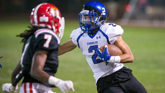 Chandler running back Chase Lucas runs during a high school football game against Phoenix Brophy Prep at Phoenix College on Friday, October 23, 2015.