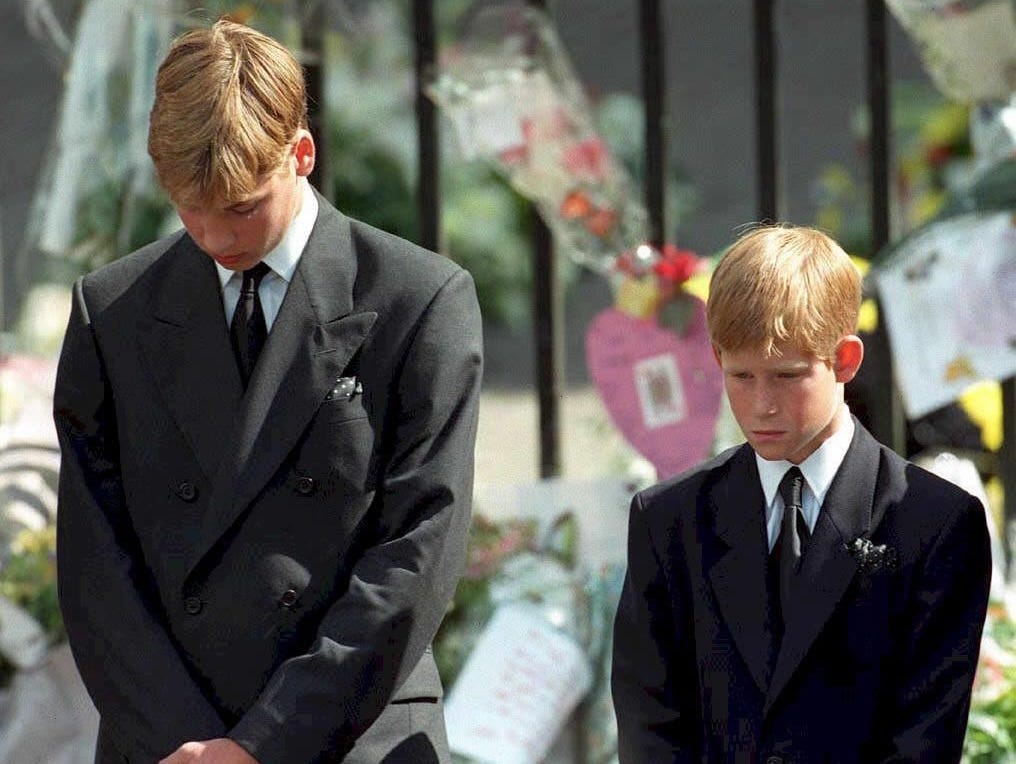 Prince William and Prince Harry bow their heads at their mother's funeral service September 6, 1997.