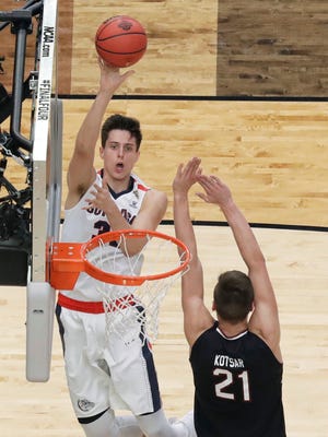 Gonzaga forward Zach Collins shoots over South Carolina forward Maik Kotsar (21) during the first half in the semifinals of the Final Four NCAA college basketball tournament, Saturday, April 1, 2017, in Glendale, Ariz. (AP Photo/David J. Phillip)