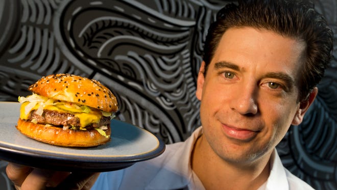 George Lambertson, Chef at ArtsRiot on Pine Street in Burlington's South End, with his cheeseburger. Lambertson, a Burlington Free Press contributor, will write a monthly column about restaurants and cooking, "On the Line."