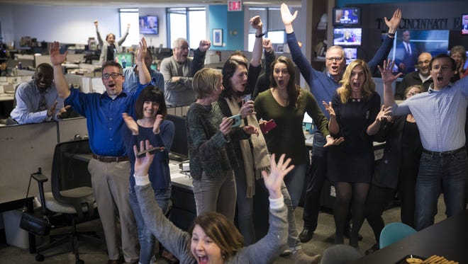 Staff members of the Cincinnati Enquirer celebrate winning the Pulitzer Prize for Seven Days of Heroin coverage. Photo shot Monday April 16, 2018