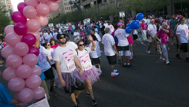 People make their way on the 5k walk during the Phoenix Race for the Cure in Phoenix on Oct. 11, 2015.