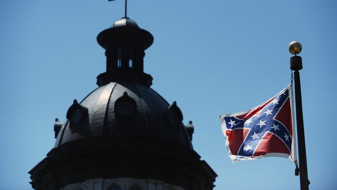 The Confederate flag flies near the South Carolina Statehouse, Friday, June 19, 2015, in Columbia, S.C.