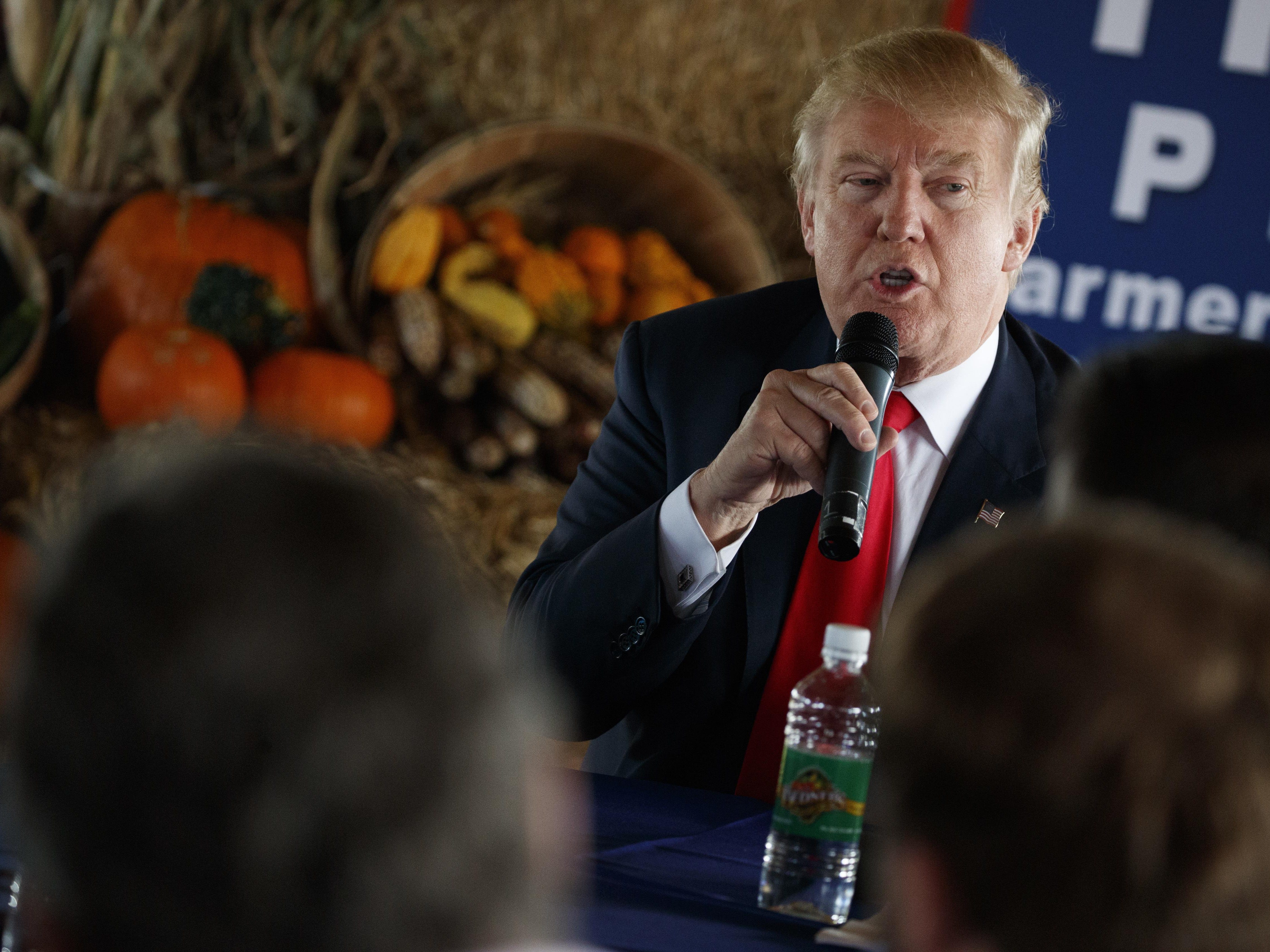FILE - In this Oct. 24, 2016 file photo, Republican presidential candidate Donald Trump speaks during a meeting with local farmers at Bedners Farm Fresh Market in Boynton Beach, Fla. Florida Gov. Scott may serve as a model and warning for President-e