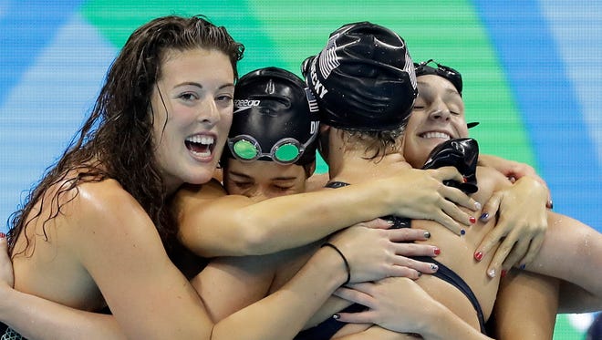 Katie Ledecky, second from right, celebrates with her American teammates, Allison Schmitt, Maya DiRado and Leah Smith, from left, after winning the women's 4 x 200-meter freestyle relay final on Wednesday.