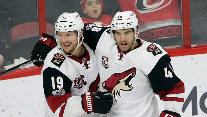 Arizona Coyotes' Shane Doan (19) and Jordan Martinook (48) celebrate Martinook's winning goal during the third period of an NHL hockey game against the Carolina Hurricanes in Raleigh, N.C., Friday, March 3, 2017.