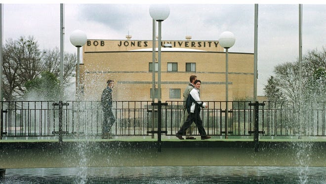 This undated file photo shows the Rodeheaver Auditorium on the campus of Bob Jones University as students walk across the bridge on their way to class.