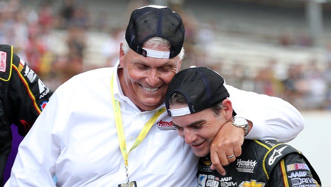 Rick Hendricks and Jeff Gordon embrace after winning his fifth Brickyard 400 at the Indianapolis Motor Speedway, July 27, 2014.