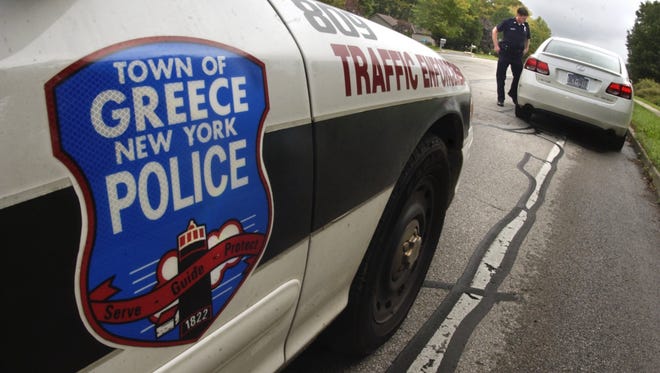 A town of Greece police officer makes a traffic stop. The Police Department’s state accreditation was renewed after an in-depth review.