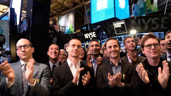 From left to right: Twitter CEO Dick Costolo, Chairman and co-founder Jack Dorsey, and co-founders Evan Williams and Biz Stone applaud as Twitter started trading at the New York Stock Exchange in 2013.