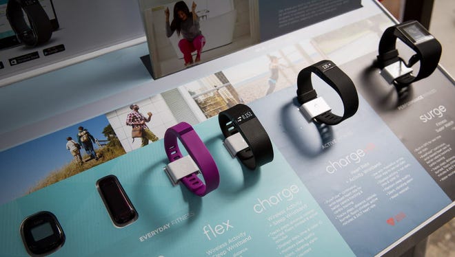 The line of Fitbit products are displayed during a lunchtime workout event outside the New York Stock Exchange during the IPO debut of the company on June 18, 2015 in New York City.