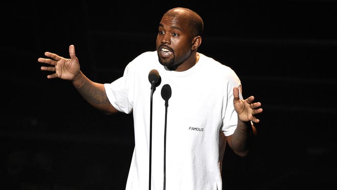 FILE - In this Aug. 28, 2016, file photo. Kanye West appears at the MTV Video Music Awards at Madison Square Garden in New York. At a Sacramento concert Saturday, Nov. 19, West told the audience he heard Beyoncé refused to perform at the MTV Video Music Awards unless she won Video of the Year over him, and also urged Jay Z to call him and not to send killers.  (Photo by Chris Pizzello/Invision/AP, File)