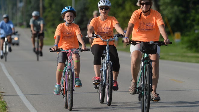 Cyclists participate in the 2015 ReidRide in Richmond. The ride raises money to provide shoes for kids.