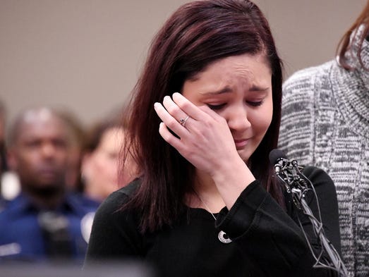 Kaylee Lorincz weeps while telling her story. At 13,