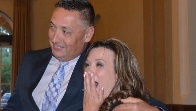 Barwise Middle School eighth-grade science teacher Jennifer Parker, seen with Superintendent Michael Kuhrt, is ecstatic after being named Wichita Falls ISD's Secondary Teacher of the Year at a banquet April 6 at the Forum.