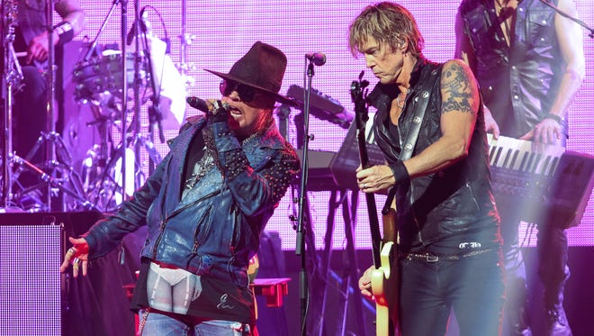 Axl Rose, left, and Duff McKagan of Guns N' Roses perform at the 6th annual Revolver Golden Gods Award Show in Los Angeles in April 2014.