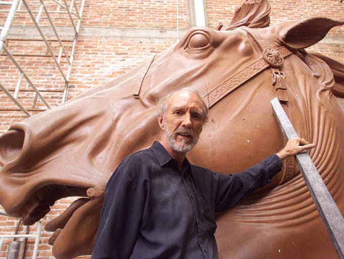 El Paso sculptor John Houser stands by the horse head