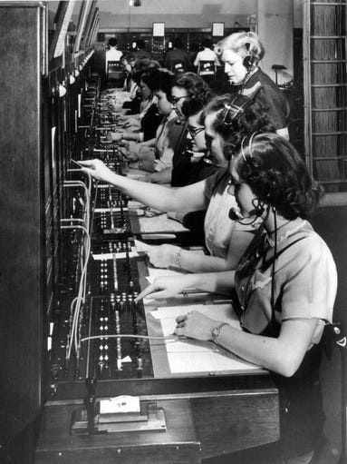 Operators work the switchboard to connect callers while