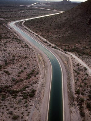 A Central Arizona Project canal stretches across the desert, bringing much-needed water from the Colorado River to Phoenix.