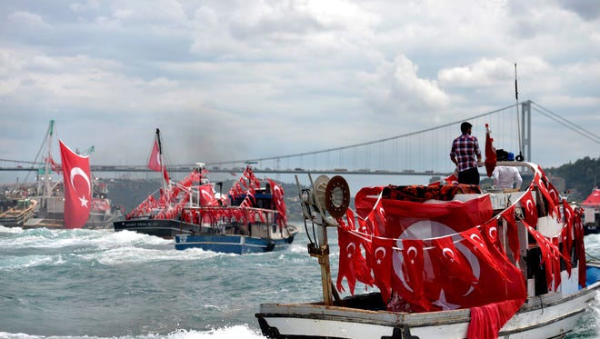 Turkish fishermen demonstrate at Bosphorus with Turkish flags against the July 15 failed coup attempt , in Istanbul, Turkey, on July 20, 2016.