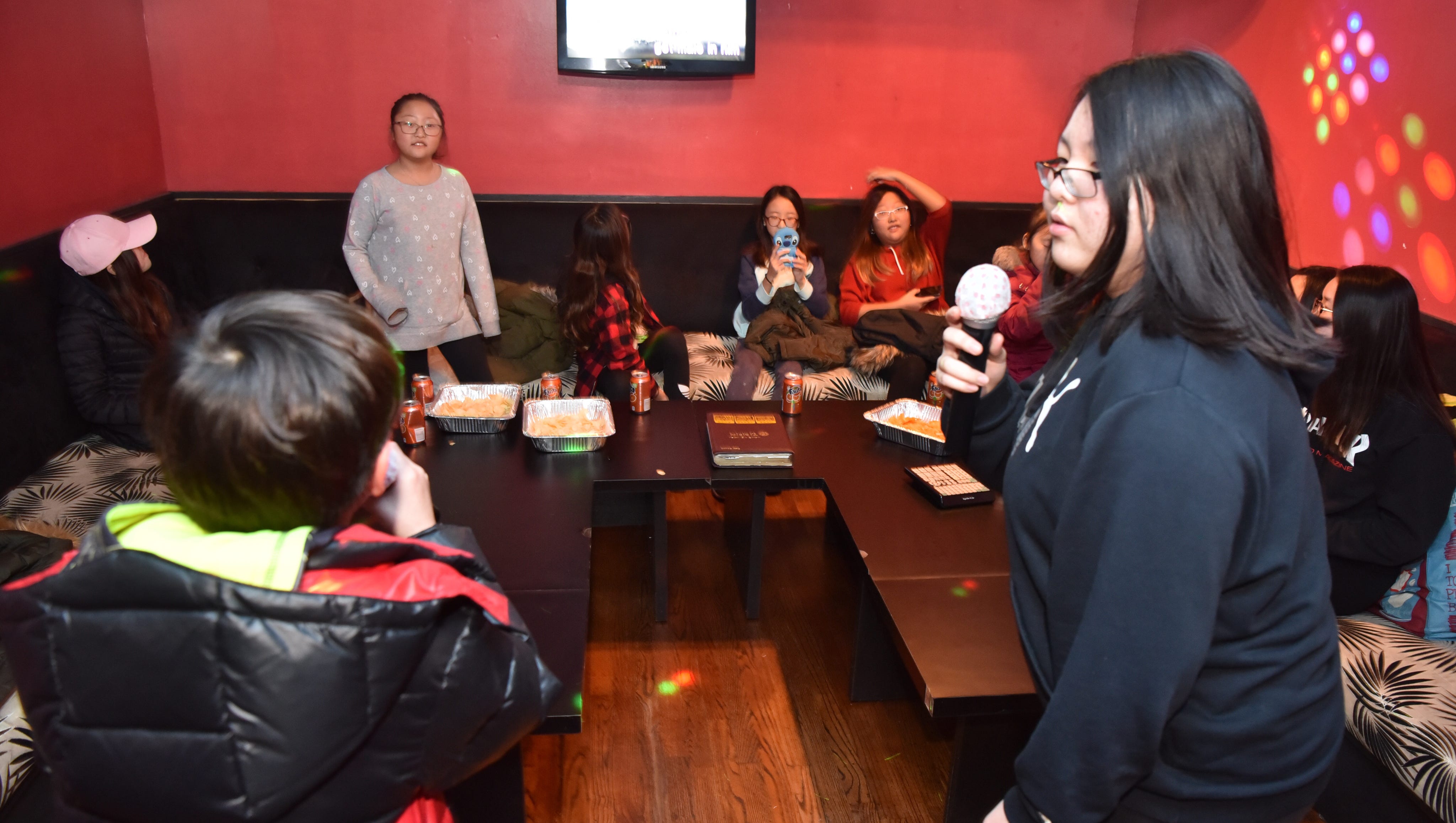 On the eve of Olympics, Korean-style karaoke lets amateurs shine