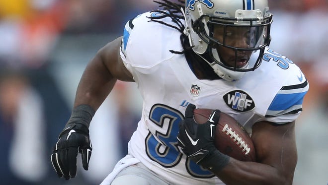Detroit Lions Joique Bell runs against the Chicago Bears during first half action Sunday.