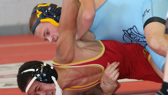 River Valley's Grant Isler (top) gets the best of Nico Grier of Big Walnut in the 120 weight class at the Harding County Wrestling Invitational held this weekend at Veterans Memorial Coliseum on Saturday, Jan. 17, 2015. James Miller/The Marion Star