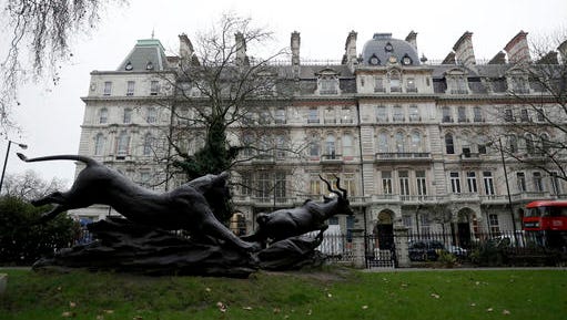 A statue stands in a square across the street from a building, third right domed roof, where offices of Orbis Business Intelligence Ltd are located, in central London, Thursday Jan. 12, 2017. An unsubstantiated dossier on US President elect, Donald Trump, which has been circulating in Washington for months, was compiled by a former Western intelligence operative, identified Wednesday by The Wall Street Journal as Christopher Steele of London-based Orbis Business Intelligence Ltd. (AP Photo/Matt Dunham)