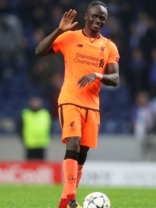 Liverpool's Sadio Mane celebrates at the end of the Champions League round of sixteen first leg soccer match between FC Porto and Liverpool FC at the Dragao stadium in Porto, Portugal, Wednesday, Feb. 14, 2018. Mane scored three goals in Liverpool's 5-0 win. (AP Photo/Luis Vieira)