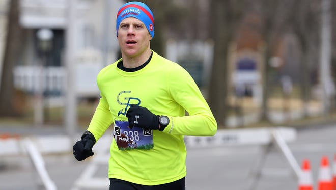 Karl O'Reilly of Morristown comes in for a first place finish in the annual Super Sunday Pre-Game 4 Miler in Morristown on Feb. 5.