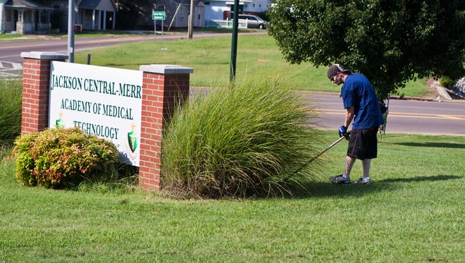 File photo of volunteers with the Jackson Area Council on Alcoholism and Drug Dependency and Youth Town went to Jackson Central-Merry High School on Tuesday to cut grass and trim bushes in 2014.