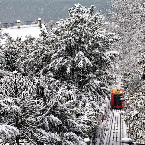 Ride the funicular to snowy Brunate