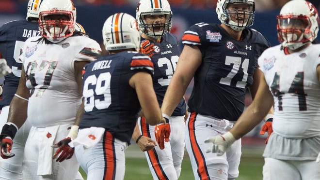 Auburn place kicker Daniel Carlson (38) watches a 56-yard field goal go through the uprights during the NCAA football game between Auburn and Louisville on Saturday, Sept. 5, 2015, in at the Georgia Dome in Atlanta, Ga. 