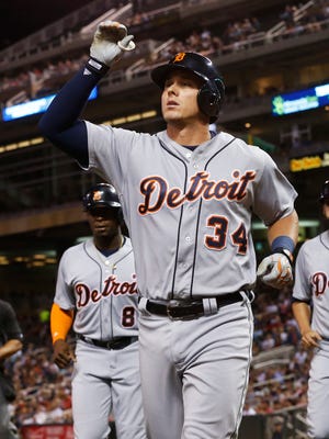 Detroit Tigers' James McCann celebrates his three-run home run off Minnesota Twins pitcher Hector Santiago in the sixth inning of a baseball game Tuesday, Sept. 20, 2016, in Minneapolis.