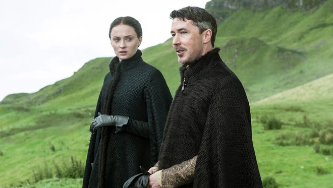 In this image released by HBO, Sophie Turner, as Sansa Stark, left, and Aidan Gillen, as Petyr "Littlefinger" Baelish, appear in a scene from the HBO original series, "Game of Thrones," premiering Sunday, April 12, 2015, on HBO. For the first time, "Game of Thrones" and AMC's "Mad Men," which premieres April 5, will be available to so-called cord cutters _ legally. (AP Photo/HBO)