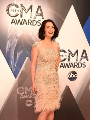 Katie Armiger arrives on the red carpet at the 49th annual CMA Awards at Bridgestone Arena in Nashville on Nov. 4, 2015.