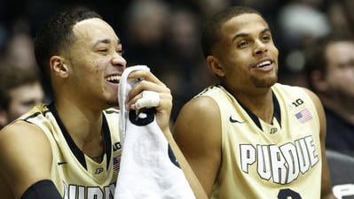 Kendall Stephens and P.J.Thompson enjoy Wednesday's 83-67 victory over Indiana from the bench.