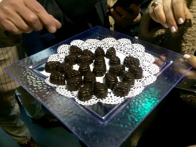 Guests sample Jacques Torres' truffles at the museum's