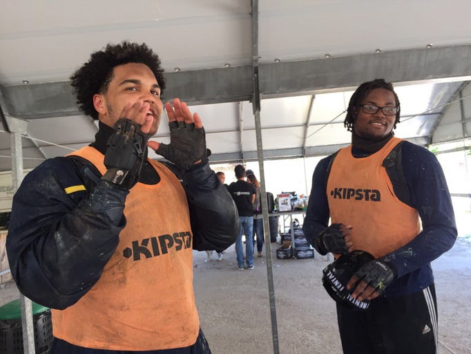 Carlo Kemp and Rashan Gary, right, during the paintball