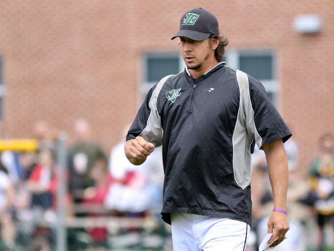 James Buchanan coach Dave Sanchez walks across the