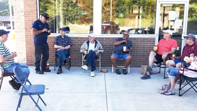 After meeting for coffee at the local McDonald's, this coffee club didn't let a little thing like a closed lobby keep them from meeting.
