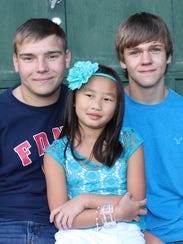 Tayler Schmid, right, is shown a few months before