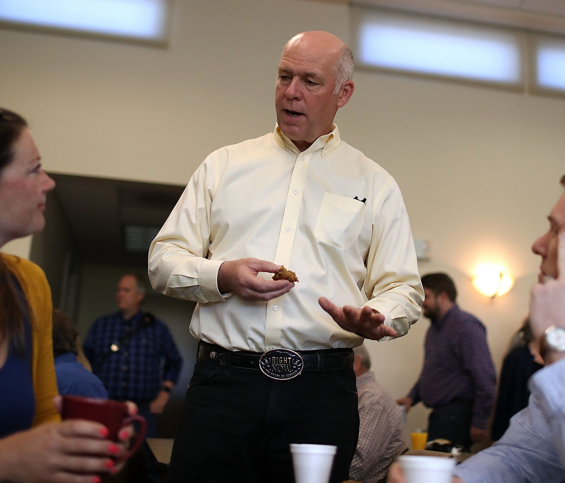 Republican congressional candidate Greg Gianforte is pictured talking with supporters during a campaign meet and greet.
